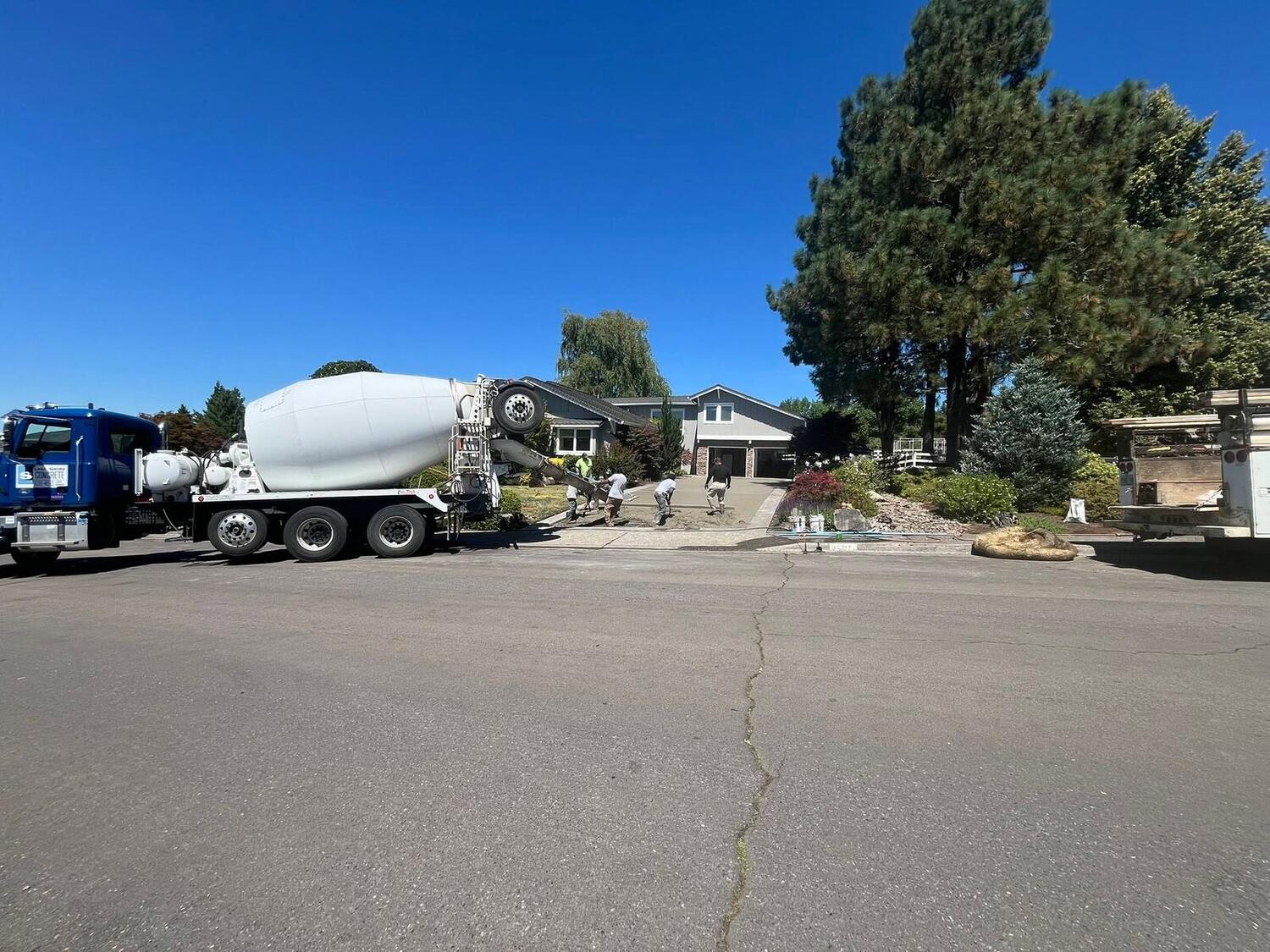 Zuber Concrete crew and mixer truck pouring a driveway