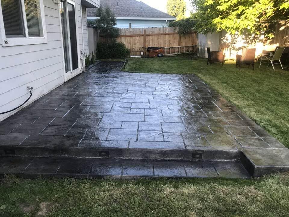 Stamped and dyed concrete patio by Zuber Concrete
