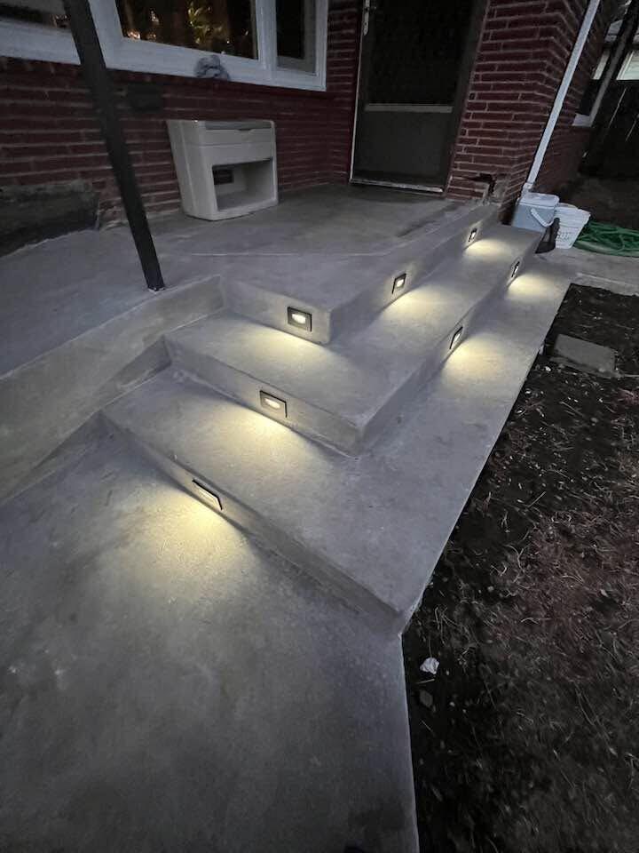 Concrete steps with built-in lighting by Zuber Concrete